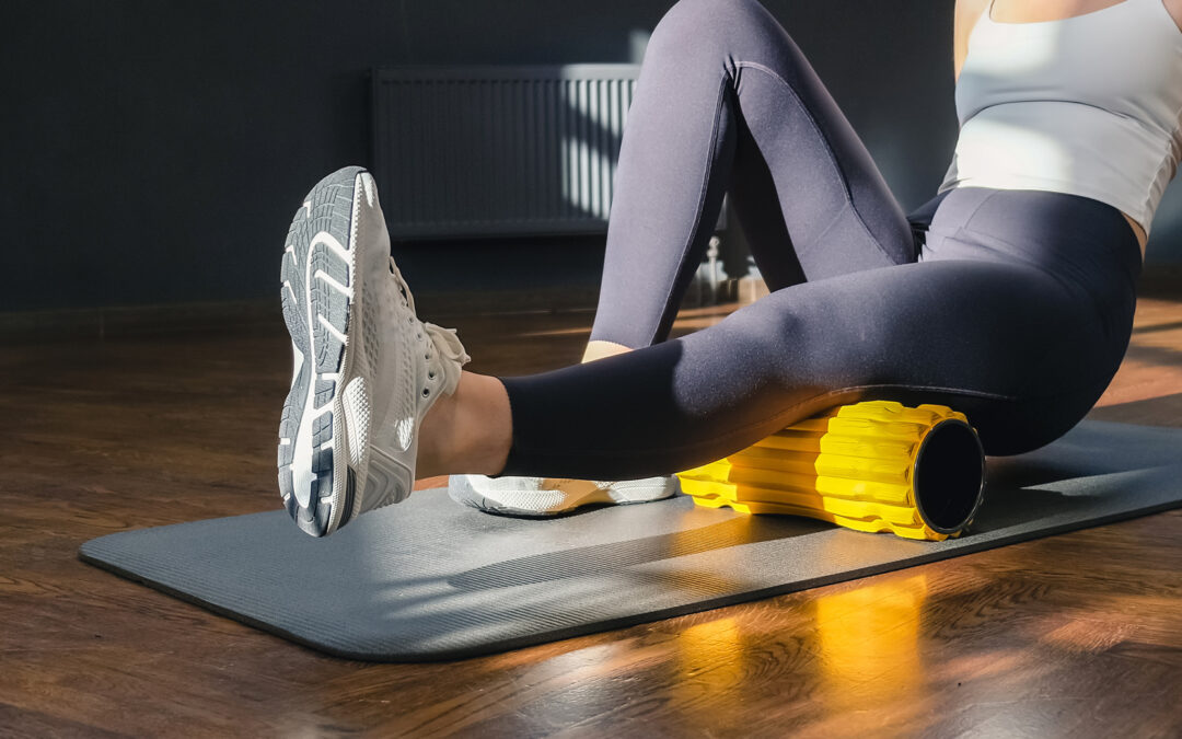 Women doing stretching with roller for myofascial release